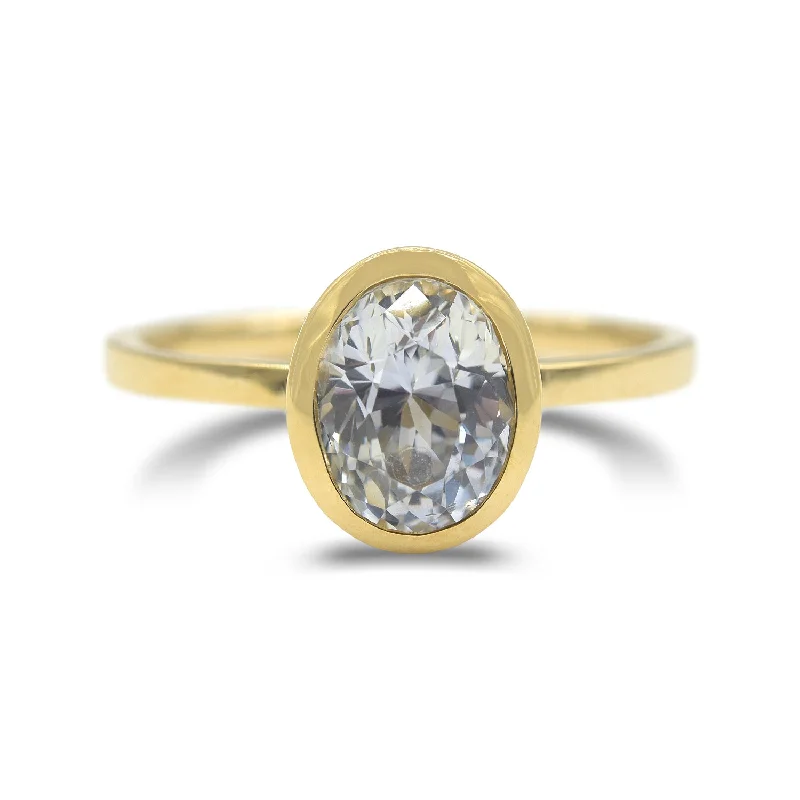 Contemporary design ladies rings-Ethereal white sapphire bezel set ring in 14k yellow gold